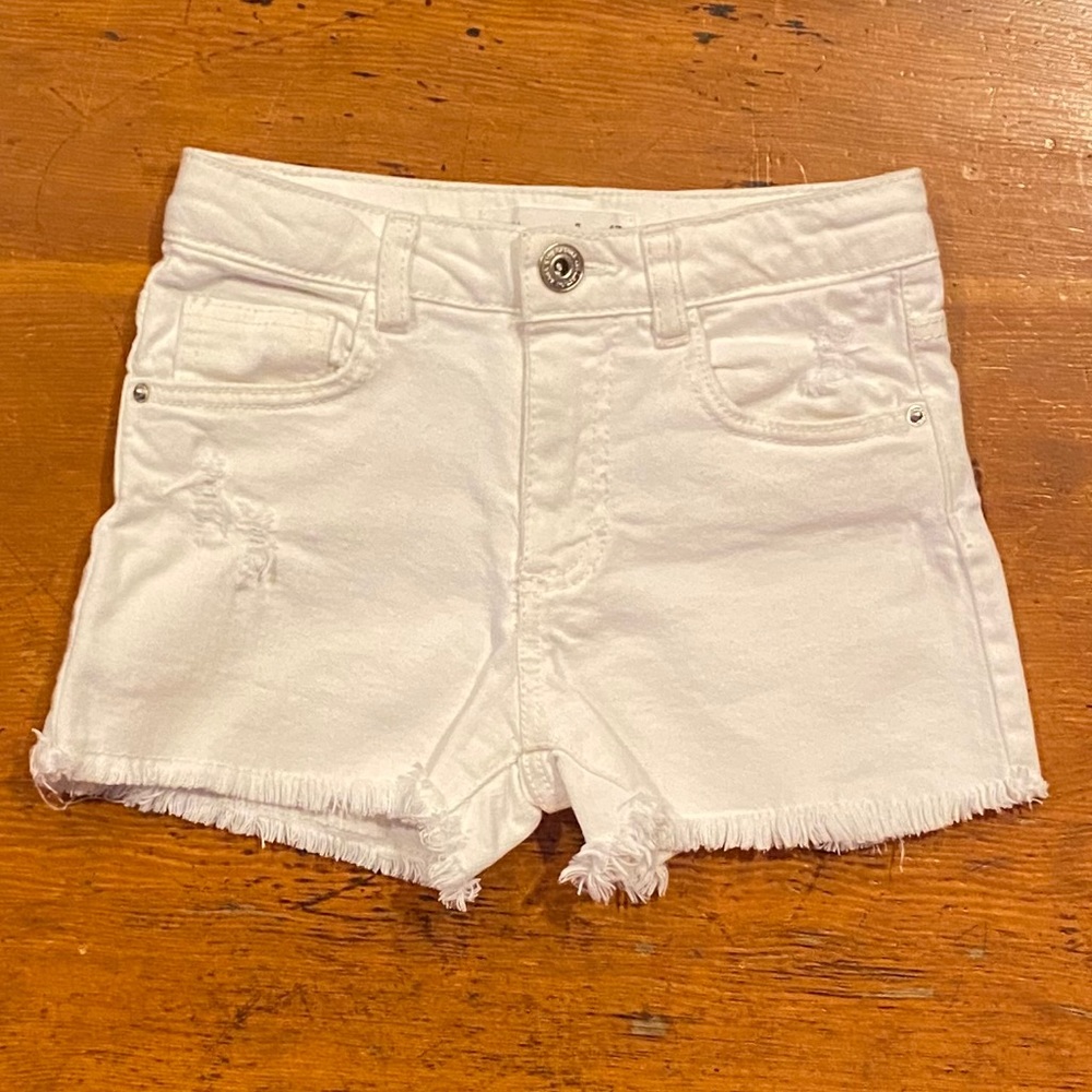 Zara brand white distressed jean shorts